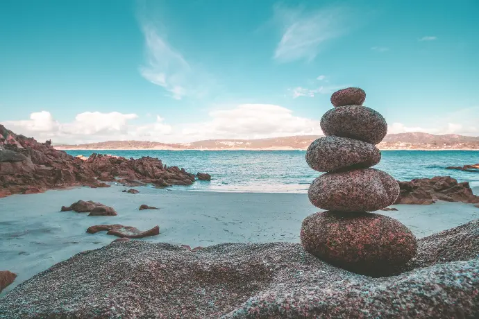 gray rocks on seashore during daytime